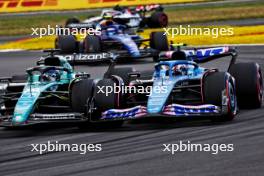 (L to R): Logan Sargeant (USA) Williams Racing FW45 and Pierre Gasly (FRA) Alpine F1 Team A523 battle for position. 09.07.2023. Formula 1 World Championship, Rd 11, British Grand Prix, Silverstone, England, Race Day.