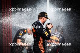 Race winner Max Verstappen (NLD) Red Bull Racing celebrates on the podium with Paul Monaghan (GBR) Red Bull Racing Chief Engineer and team mate Sergio Perez (MEX) Red Bull Racing. 23.07.2023. Formula 1 World Championship, Rd 12, Hungarian Grand Prix, Budapest, Hungary, Race Day.