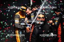 Lando Norris (GBR) McLaren celebrates his second position on the podium with race winner Max Verstappen (NLD) Red Bull Racing. 23.07.2023. Formula 1 World Championship, Rd 12, Hungarian Grand Prix, Budapest, Hungary, Race Day.