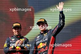 Race winner Max Verstappen (NLD) Red Bull Racing celebrates on the podium with third placed team mate Sergio Perez (MEX) Red Bull Racing. 23.07.2023. Formula 1 World Championship, Rd 12, Hungarian Grand Prix, Budapest, Hungary, Race Day.