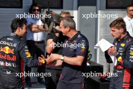 (L to R): Sergio Perez (MEX) Red Bull Racing celebrates his third position in parc ferme with Paul Monaghan (GBR) Red Bull Racing Chief Engineer and race winner Max Verstappen (NLD) Red Bull Racing. 23.07.2023. Formula 1 World Championship, Rd 12, Hungarian Grand Prix, Budapest, Hungary, Race Day.