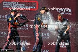 (L to R): Race winner Max Verstappen (NLD) Red Bull Racing celebrates on the podium with second placed team mate Sergio Perez (MEX) Red Bull Racing and Paul Monaghan (GBR) Red Bull Racing Chief Engineer. 23.07.2023. Formula 1 World Championship, Rd 12, Hungarian Grand Prix, Budapest, Hungary, Race Day.