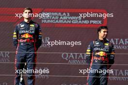(L to R): Race winner Max Verstappen (NLD) Red Bull Racing on the podium with third placed team mate Sergio Perez (MEX) Red Bull Racing. 23.07.2023. Formula 1 World Championship, Rd 12, Hungarian Grand Prix, Budapest, Hungary, Race Day.