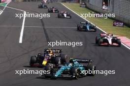 Fernando Alonso (ESP) Aston Martin F1 Team AMR23 and Sergio Perez (MEX) Red Bull Racing RB19 battle for position. 23.07.2023. Formula 1 World Championship, Rd 12, Hungarian Grand Prix, Budapest, Hungary, Race Day.