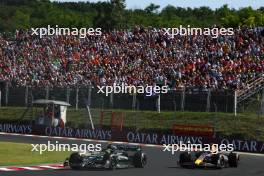 Lewis Hamilton (GBR) Mercedes AMG F1 W14 and Sergio Perez (MEX) Red Bull Racing RB19 battle for position. 23.07.2023. Formula 1 World Championship, Rd 12, Hungarian Grand Prix, Budapest, Hungary, Race Day.