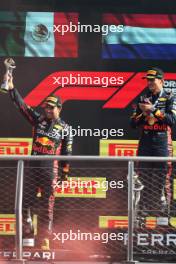 (L to R): Sergio Perez (MEX) Red Bull Racing celebrates his second position on the podium with team mate and race winner Max Verstappen (NLD) Red Bull Racing. 03.09.2023. Formula 1 World Championship, Rd 15, Italian Grand Prix, Monza, Italy, Race Day.