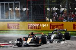 Oscar Piastri (AUS) McLaren MCL60 and Lewis Hamilton (GBR) Mercedes AMG F1 W14. 03.09.2023. Formula 1 World Championship, Rd 15, Italian Grand Prix, Monza, Italy, Race Day.