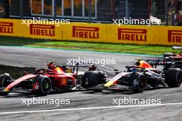 Carlos Sainz Jr (ESP) Ferrari SF-23 and Sergio Perez (MEX) Red Bull Racing RB19 battle for position. 03.09.2023. Formula 1 World Championship, Rd 15, Italian Grand Prix, Monza, Italy, Race Day.
