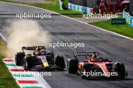 Sergio Perez (MEX) Red Bull Racing RB19 and Charles Leclerc (MON) Ferrari SF-23 battle for position. 03.09.2023. Formula 1 World Championship, Rd 15, Italian Grand Prix, Monza, Italy, Race Day.