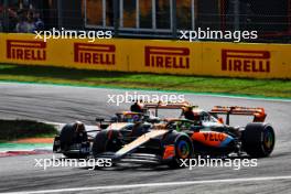 Lando Norris (GBR) McLaren MCL60 and Oscar Piastri (AUS) McLaren MCL60 battle for position. 03.09.2023. Formula 1 World Championship, Rd 15, Italian Grand Prix, Monza, Italy, Race Day.