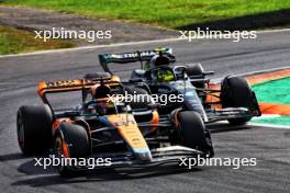 Oscar Piastri (AUS) McLaren MCL60 and Lewis Hamilton (GBR) Mercedes AMG F1 W14. 03.09.2023. Formula 1 World Championship, Rd 15, Italian Grand Prix, Monza, Italy, Race Day.