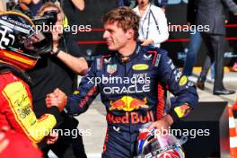 Carlos Sainz Jr (ESP) Ferrari celebrates his pole position in qualifying parc ferme with Max Verstappen (NLD) Red Bull Racing. 02.09.2023. Formula 1 World Championship, Rd 15, Italian Grand Prix, Monza, Italy, Qualifying Day.
