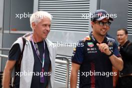 (L to R): Daniel Reinhardt (GER) Photographer with Sergio Perez (MEX) Red Bull Racing. 31.08.2023. Formula 1 World Championship, Rd 15, Italian Grand Prix, Monza, Italy, Preparation Day.