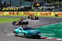 Max Verstappen (NLD) Red Bull Racing RB19 leads behind the Aston Martin FIA Safety Car. 24.09.2023. Formula 1 World Championship, Rd 17, Japanese Grand Prix, Suzuka, Japan, Race Day.
