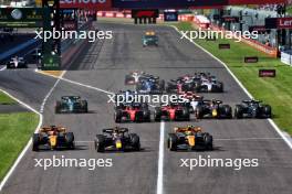 (L to R): Oscar Piastri (AUS) McLaren MCL60; Max Verstappen (NLD) Red Bull Racing RB19; and Lando Norris (GBR) McLaren MCL60 lead at the start of the race. 24.09.2023. Formula 1 World Championship, Rd 17, Japanese Grand Prix, Suzuka, Japan, Race Day.