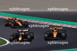 (L to R): Max Verstappen (NLD) Red Bull Racing RB19 and Lando Norris (GBR) McLaren MCL60 battle for position at the start of the race. 24.09.2023. Formula 1 World Championship, Rd 17, Japanese Grand Prix, Suzuka, Japan, Race Day.