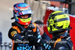 Lando Norris (GBR) McLaren (Right) celebrates his third position in qualifying parc ferme with second placed team mate Lando Norris (GBR) McLaren. 23.09.2023. Formula 1 World Championship, Rd 17, Japanese Grand Prix, Suzuka, Japan, Qualifying Day.