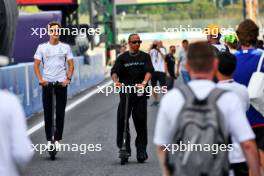 (L to R): George Russell (GBR) Mercedes AMG F1 with team mate Lewis Hamilton (GBR) Mercedes AMG F1 on scooters. 21.09.2023. Formula 1 World Championship, Rd 17, Japanese Grand Prix, Suzuka, Japan, Preparation Day.