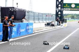 (L to R): Lewis Hamilton (GBR) Mercedes AMG F1 and Esteban Ocon (FRA) Alpine F1 Team with radio controlled cars. 21.09.2023. Formula 1 World Championship, Rd 17, Japanese Grand Prix, Suzuka, Japan, Preparation Day.