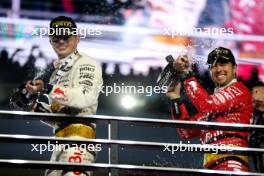 (L to R): Race winner Max Verstappen (NLD) Red Bull Racing celebrates on the podium with third placed Sergio Perez (MEX) Red Bull Racing.  18.11.2023. Formula 1 World Championship, Rd 22, Las Vegas Grand Prix, Las Vegas, Nevada, USA, Race Day.