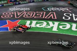 Max Verstappen (NLD) Red Bull Racing RB19 and Charles Leclerc (MON) Ferrari SF-23 battle for the lead at the start of the race. 18.11.2023. Formula 1 World Championship, Rd 22, Las Vegas Grand Prix, Las Vegas, Nevada, USA, Race Day.
