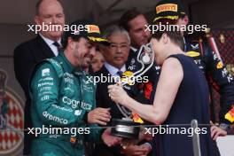 Fernando Alonso (ESP) Aston Martin F1 Team celebrates his second position on the podium with Princess Charlene of Monaco. 28.05.2023. Formula 1 World Championship, Rd 7, Monaco Grand Prix, Monte Carlo, Monaco, Race Day.