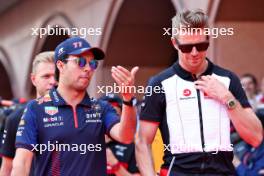 (L to R): Sergio Perez (MEX) Red Bull Racing with Nico Hulkenberg (GER) Haas F1 Team on the drivers' parade. 28.05.2023. Formula 1 World Championship, Rd 7, Monaco Grand Prix, Monte Carlo, Monaco, Race Day.