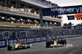 (L to R): Sergio Perez (MEX) Red Bull Racing RB19 and Max Verstappen (NLD) Red Bull Racing RB19 battle for the lead of the race. 07.05.2023. Formula 1 World Championship, Rd 5, Miami Grand Prix, Miami, Florida, USA, Race Day.