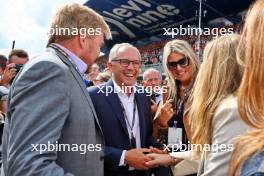 King Willem-Alexander (NLD) on the grid with his wife Queen Maxima and Stefano Domenicali (ITA) Formula One President and CEO. 27.08.2023. Formula 1 World Championship, Rd 14, Dutch Grand Prix, Zandvoort, Netherlands, Race Day.