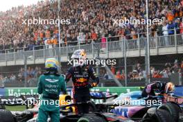 Race winner Max Verstappen (NLD) Red Bull Racing celebrates in parc ferme with second placed Fernando Alonso (ESP) Aston Martin F1 Team (Left). 27.08.2023. Formula 1 World Championship, Rd 14, Dutch Grand Prix, Zandvoort, Netherlands, Race Day.