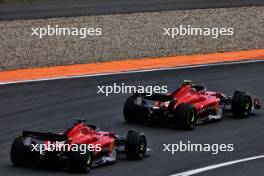 Carlos Sainz Jr (ESP) Ferrari SF-23 and Charles Leclerc (MON) Ferrari SF-23 battle for position. 27.08.2023. Formula 1 World Championship, Rd 14, Dutch Grand Prix, Zandvoort, Netherlands, Race Day.