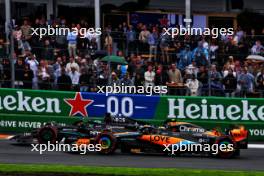George Russell (GBR) Mercedes AMG F1 W14 and Oscar Piastri (AUS) McLaren MCL60 battle for position. 27.08.2023. Formula 1 World Championship, Rd 14, Dutch Grand Prix, Zandvoort, Netherlands, Race Day.