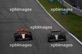 Lando Norris (GBR) McLaren MCL60 and Lewis Hamilton (GBR) Mercedes AMG F1 W14 battle for position. 27.08.2023. Formula 1 World Championship, Rd 14, Dutch Grand Prix, Zandvoort, Netherlands, Race Day.
