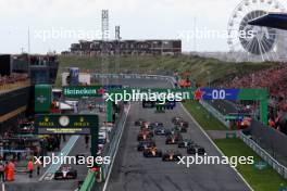 Max Verstappen (NLD) Red Bull Racing RB19 leads at the start of the race. 27.08.2023. Formula 1 World Championship, Rd 14, Dutch Grand Prix, Zandvoort, Netherlands, Race Day.