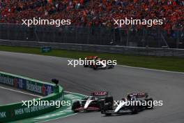 Kevin Magnussen (DEN) Haas VF-23 and Yuki Tsunoda (JPN) AlphaTauri AT04 battle for position. 27.08.2023. Formula 1 World Championship, Rd 14, Dutch Grand Prix, Zandvoort, Netherlands, Race Day.