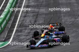Pierre Gasly (FRA) Alpine F1 Team A523 and Max Verstappen (NLD) Red Bull Racing RB19 battle for position. 27.08.2023. Formula 1 World Championship, Rd 14, Dutch Grand Prix, Zandvoort, Netherlands, Race Day.