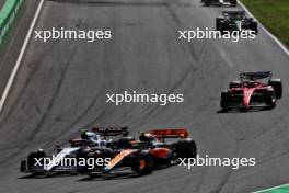 Lando Norris (GBR) McLaren MCL60 and Yuki Tsunoda (JPN) AlphaTauri AT04 battle for position. 27.08.2023. Formula 1 World Championship, Rd 14, Dutch Grand Prix, Zandvoort, Netherlands, Race Day.