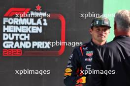Pole sitter Max Verstappen (NLD) Red Bull Racing in qualifying parc ferme with David Coulthard (GBR) Red Bull Racing and Scuderia Toro Advisor / Channel 4 F1 Commentator. 26.08.2023. Formula 1 World Championship, Rd 14, Dutch Grand Prix, Zandvoort, Netherlands, Qualifying Day.