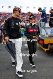 (L to R): George Russell (GBR) Mercedes AMG F1 with Zhou Guanyu (CHN) Alfa Romeo F1 Team on the drivers' parade. 27.08.2023. Formula 1 World Championship, Rd 14, Dutch Grand Prix, Zandvoort, Netherlands, Race Day.