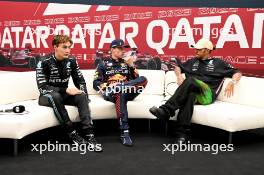 (L to R): George Russell (GBR) Mercedes AMG F1; Max Verstappen (NLD) Red Bull Racing; and Lewis Hamilton (GBR) Mercedes AMG F1 in the post qualifying FIA Press Conference. 06.10.2023 Formula 1 World Championship, Rd 18, Qatar Grand Prix, Doha, Qatar, Qualifying Day.