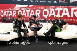 (L to R): George Russell (GBR) Mercedes AMG F1; Max Verstappen (NLD) Red Bull Racing; and Lewis Hamilton (GBR) Mercedes AMG F1 in the post qualifying FIA Press Conference. 06.10.2023 Formula 1 World Championship, Rd 18, Qatar Grand Prix, Doha, Qatar, Qualifying Day.
