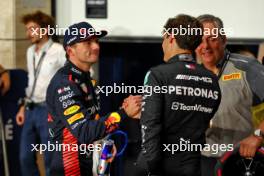 (L to R): Pole sitter Max Verstappen (NLD) Red Bull Racing with George Russell (GBR) Mercedes AMG F1 in qualifying parc ferme. 06.10.2023 Formula 1 World Championship, Rd 18, Qatar Grand Prix, Doha, Qatar, Qualifying Day.