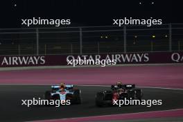 Logan Sargeant (USA) Williams Racing FW45 and Zhou Guanyu (CHN) Alfa Romeo F1 Team C43 battle for position. 08.10.2023. Formula 1 World Championship, Rd 18, Qatar Grand Prix, Doha, Qatar, Race Day.