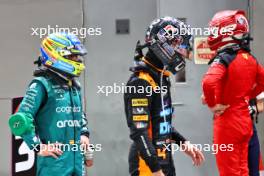 (L to R): Fernando Alonso (ESP) Aston Martin F1 Team; Lando Norris (GBR) McLaren; and Charles Leclerc (MON) Ferrari, in qualifying parc ferme. 16.09.2023. Formula 1 World Championship, Rd 16, Singapore Grand Prix, Marina Bay Street Circuit, Singapore, Qualifying Day.