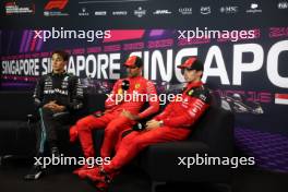 (L to R): George Russell (GBR) Mercedes AMG F1; Carlos Sainz Jr (ESP) Ferrari; and Charles Leclerc (MON) Ferrari, in the post qualifying FIA Press Conference. 16.09.2023. Formula 1 World Championship, Rd 16, Singapore Grand Prix, Marina Bay Street Circuit, Singapore, Qualifying Day.