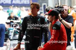 (L to R): George Russell (GBR) Mercedes AMG F1 with Charles Leclerc (MON) Ferrari in qualifying parc ferme. 16.09.2023. Formula 1 World Championship, Rd 16, Singapore Grand Prix, Marina Bay Street Circuit, Singapore, Qualifying Day.