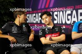 (L to R): George Russell (GBR) Mercedes AMG F1 and Zhou Guanyu (CHN) Alfa Romeo F1 Team, in the FIA Press Conference. 14.09.2023. Formula 1 World Championship, Rd 16, Singapore Grand Prix, Marina Bay Street Circuit, Singapore, Preparation Day.