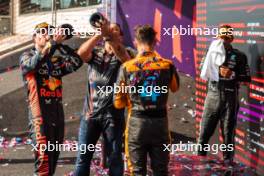 The podium (L to R): Max Verstappen (NLD) Red Bull Racing; race winner; John Hammond (GBR) Red Bull Racing Physiotherapist; Lando Norris (GBR) McLaren, third; Lewis Hamilton (GBR) Mercedes AMG F1, second. 22.10.2023. Formula 1 World Championship, Rd 19, United States Grand Prix, Austin, Texas, USA, Race Day.