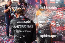 Lando Norris (GBR) McLaren celebrates his third position on the podium with third placed Lewis Hamilton (GBR) Mercedes AMG F1. 22.10.2023. Formula 1 World Championship, Rd 19, United States Grand Prix, Austin, Texas, USA, Race Day.