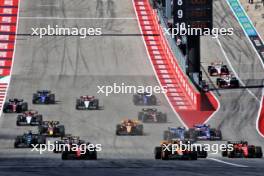 Charles Leclerc (MON) Ferrari SF-23 and Lando Norris (GBR) McLaren MCL60 at the start of the race. 22.10.2023. Formula 1 World Championship, Rd 19, United States Grand Prix, Austin, Texas, USA, Race Day.